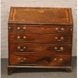 A Georgian mahogany bureau over four drawer chest raised on bracket feet with fitted interior, 104cm