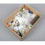 A box of assorted watch parts for spares and repair.