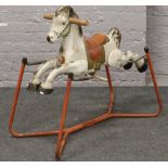 A vintage Mobo Prairie King rocking horse.