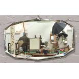 An oval bevel edge wall mirror.