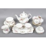 A Royal Albert Moss Rose six part bone china tea set.