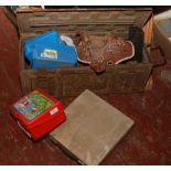 A military steel ammo box and contents of leather hand bag formed as a saddle, chisels, sharpening