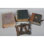 Two first World War period photograph albums including German example, a pair of ornate photograph