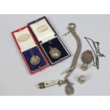 A small lot of mainly silver collectables including football medals, locket and single Albert pocket