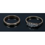 A 9ct gold and platinum five stone ring set with rose cut stones and a 9ct gold wedding band, band