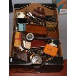 A box of collectables including vintage tins and cameras etc.
