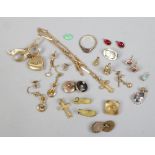 A tray of yellow metal jewellery oddments including charms, earrings and necklace etc.