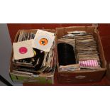 Two boxes of 45rpm singles mainly pop music with picture sleeves.