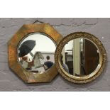 An Arts & Crafts octagonal mirror with hammered brass frame and a circular gilt framed mirror.