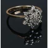 A 9ct gold diamond snowflake cluster ring. Size P.