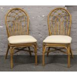 Two bamboo effect conservatory chairs.