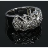 A 9ct white gold and diamond ring with openwork milgrain shank, total diamond weight 0.35ct with