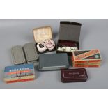 A collection of Rolls razors including boxed examples and various cased vintage electric razors