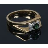 A 9ct gold tourmaline and diamond ring set on split shoulders, size N, 4.6 grams.