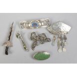 Six silver brooches to include marcasite, coloured paste stone examples.