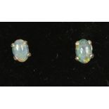 A pair of 9ct gold opal doublet earrings.