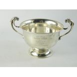 George V silver presentation bowl with twin mask head handles to side, on circular footrim, with