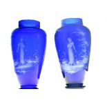 Pair of 'Mary Gregory' blue glass baluster vases, having painted female figure decoration. Small