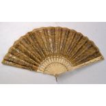 An intricately decorated bone framed vintage ladies fan with white metal work, simply beautiful!