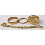 Selection of 9ct gold wedding bands and a yellow metal bracelet