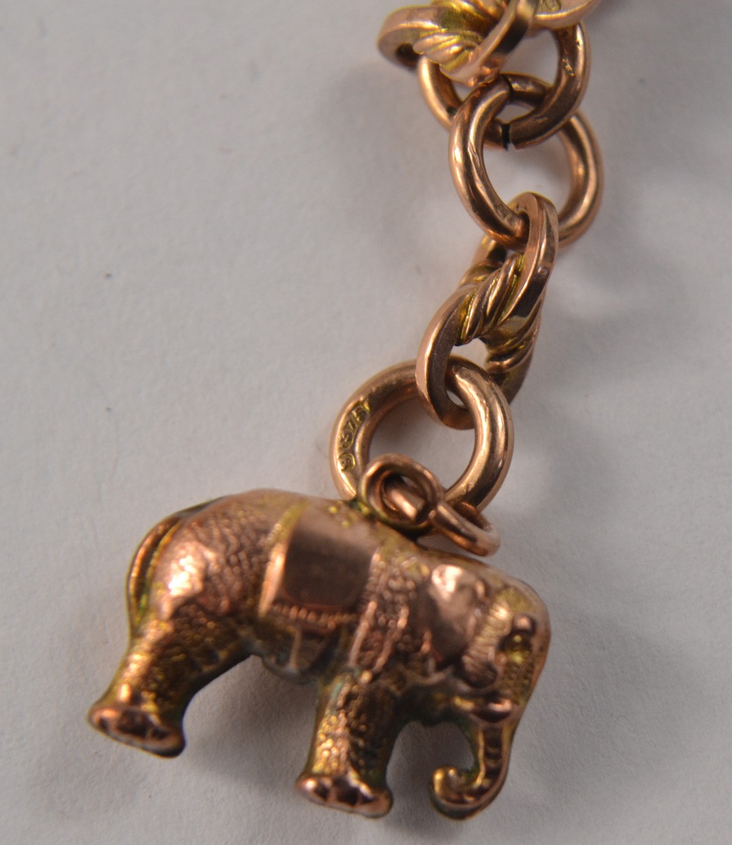 A 9ct gold necklace with a yellow metal` elephant charm pendant - Image 5 of 13