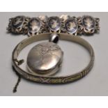 A vintage silver locket, bangle and a bracelet