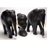 Late 19thcentury Ebony and bone African elephants both H 23cm x L 20cm approx and a tribal ebony