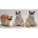 A trio of Vintage Raccoon USSR Soviet Russian Lomonosov Porcelain Figurines