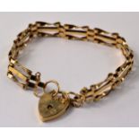 9ct gold twisted gate bar bracelet & lock.