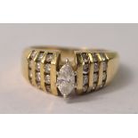 SIMPLY FABULOUS Ladies 14 carat gold diamond ring, marquise cut centre diamond, 12 further