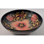 MOORCROFT bowl with blue ground and red flower design