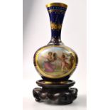 ROYAL VIENNA porcelain style vase hand painted on cobalt blue ground and gold highlighted with