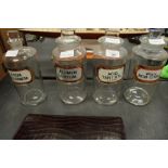 Four large Poison / Chemist's bottles and stoppers, each labelled