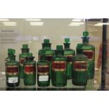 10 green moulded glass Poison/Chemists bottles and stoppers, labelled, various sizes by YG Co (A/F)