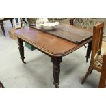 Victorian mahogany extending dining table with two leaves