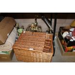 Wickerwork hamper and brass light fitting