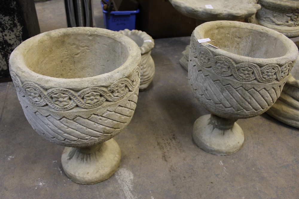 2 Mayan urns - circular planters decorated with Aztec design on circular base