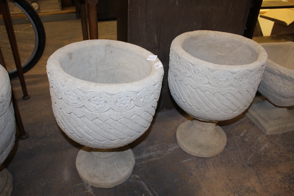 2 Mayan Urns - circular planters decorated with Aztec design on circular base