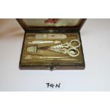 19th Century walnut and mother-of-pearl sewing set in the form of a writing slope