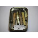 Silver cased pen knives and 3 others