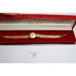 Ladies Omega Ladymatic 9ct gold cased wristwatch, with integral Milanese strap, gross weight 22.6