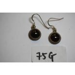 Pair of white metal & cabochon garnet earrings