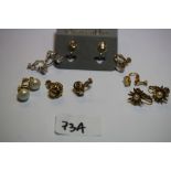 Quantity of clip on earrings, including Christian Dior