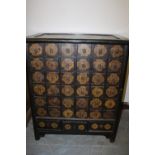 An 18th Century Chinese stained and panelled wood Medicine chest, fitted thirty nine drawers, each