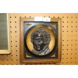 Relief carving portrait - head and shoulders