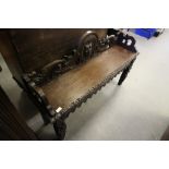 Carved Oak Hall seat with Carved Iron Mask Central Boss