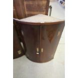 George III mahogany bow front corner cupboard