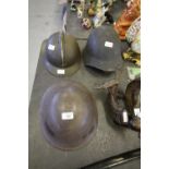Three Army helmets