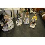 Four small continental porcelain figures