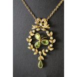 Edwardian 15ct gold peridot and seed pearl 'Three Leaf Clover' necklace, with integral neck chain